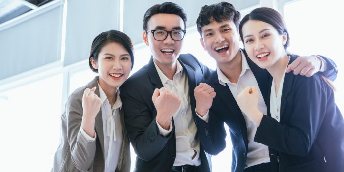 Group portrait of Asian business people