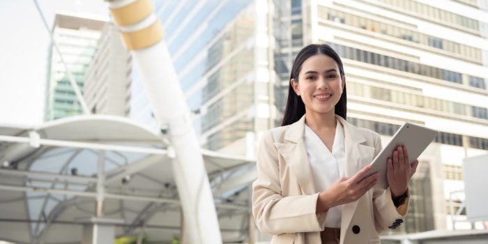 portrait-young-beautiful-businesswoman-using-tablet-modern-city