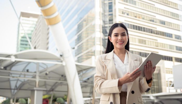 portrait-young-beautiful-businesswoman-using-tablet-modern-city
