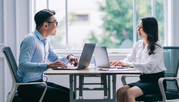 two-asian-businesspeople-working-office